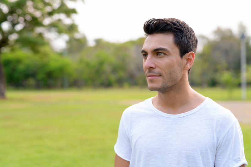 younger hispanic man outside at the park