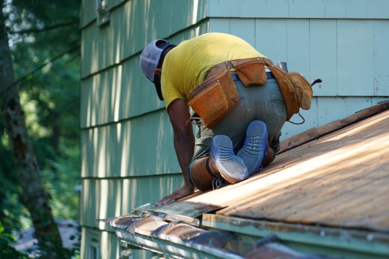 Man doing construction work on rooftop